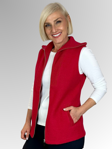 Our Red Zip Front Vest is expertly crafted from boiled wool and showcases the "Woolmark" label, known for its exceptional quality and high standards. Featuring a ribbed collar and practical pockets, this versatile piece is perfect for winter layering while offering both warmth and style.