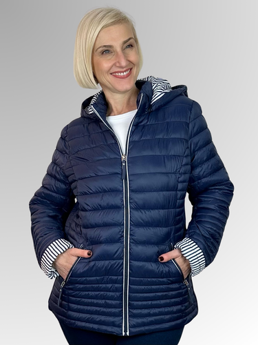Our Navy Linear Puffer Jacket by Sportswave is the ultimate choice for staying cozy on cooler days. This lightweight puffer boasts ribbed accents along the sides for a stylish twist, and comes equipped with zippered pockets and a detachable hood for added convenience and warmth. Made from polyester, it's both easy to wash and maintain.