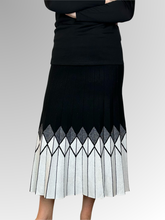 Indulge in luxury and make a statement with our Luna Knit Skirt. The bold A-Line design is both sophisticated and cozy, perfect for the cooler seasons. Crafted from a blend of rayon, wool and elastane, this mid length skirt offers comfort and style. Pair with boots for an effortlessly chic autumn/winter look.