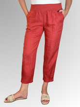 Elevate your warm-weather wardrobe with the Ankle Tuck Linen Resort Pant in Rust, the ultimate choice for effortless summer style. Perfectly balancing a trendy silhouette with everyday practicality, these pants are crafted from premium, breathable linen designed to keep you cool and comfortable all day long.