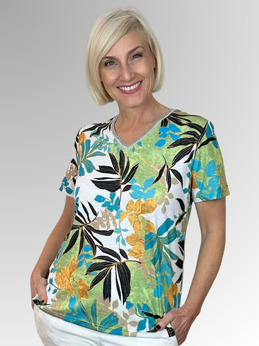 Embrace sunny days in the Aegean Tee by Jillian, featuring a vibrant tropical print that brings fun to your wardrobe. The relaxed fit and flattering V-neck offer effortless style, while the soft polyester-elastane blend ensures comfort all day long. Perfect for a carefree, summery vibe that turns heads wherever you go.