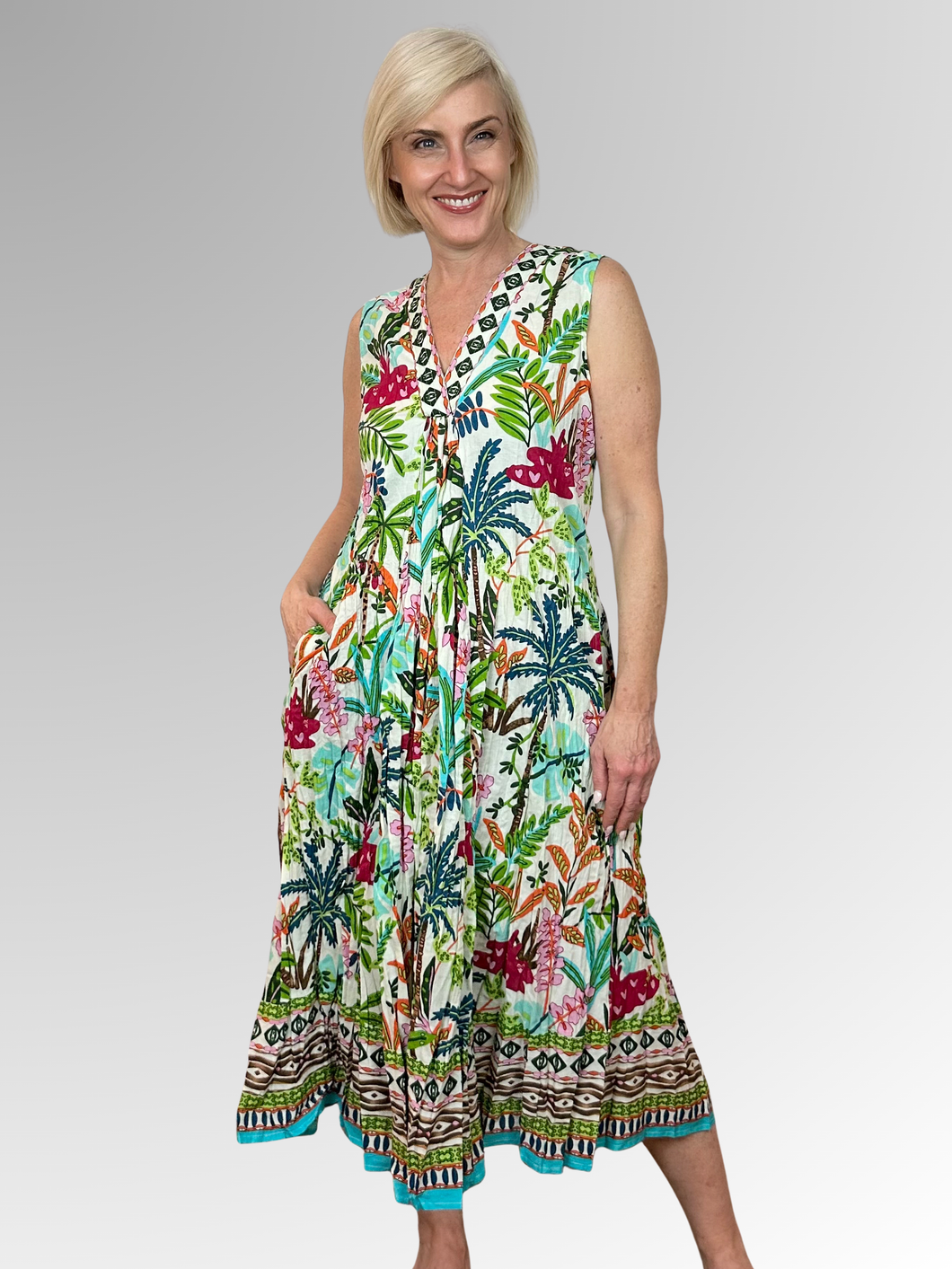 Slip into the Ovahe V-Neck Sleeveless Dress and embrace effortless summer style. Crafted from 100% organic cotton with a relaxed, flowing silhouette, this lightweight number keeps you feeling cool all day long. The flattering V-neckline and sleeveless cut offer comfort, while practical pockets add everyday functionality. Vibrant colours and prints bring personality to your wardrobe, making it the go-to choice for beach days, tropical escapes, and casual outings. Easy-care crinkled fabric means less fussing,