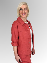 Meet the Button-Through Linen Resort Jacket in Rust, your new go-to layer for effortless, everyday style. Crafted from 100% pure linen, this lightweight jacket combines a relaxed, breezy silhouette with tailored details. It features a classic shirt collar and a full button-down front, making it easy to wear open over a tank or closed as a structured shirt. Designed for ultimate versatility, the sleeves come with built-in tab-and-button cuffs so you can easily roll them up on warmer days.