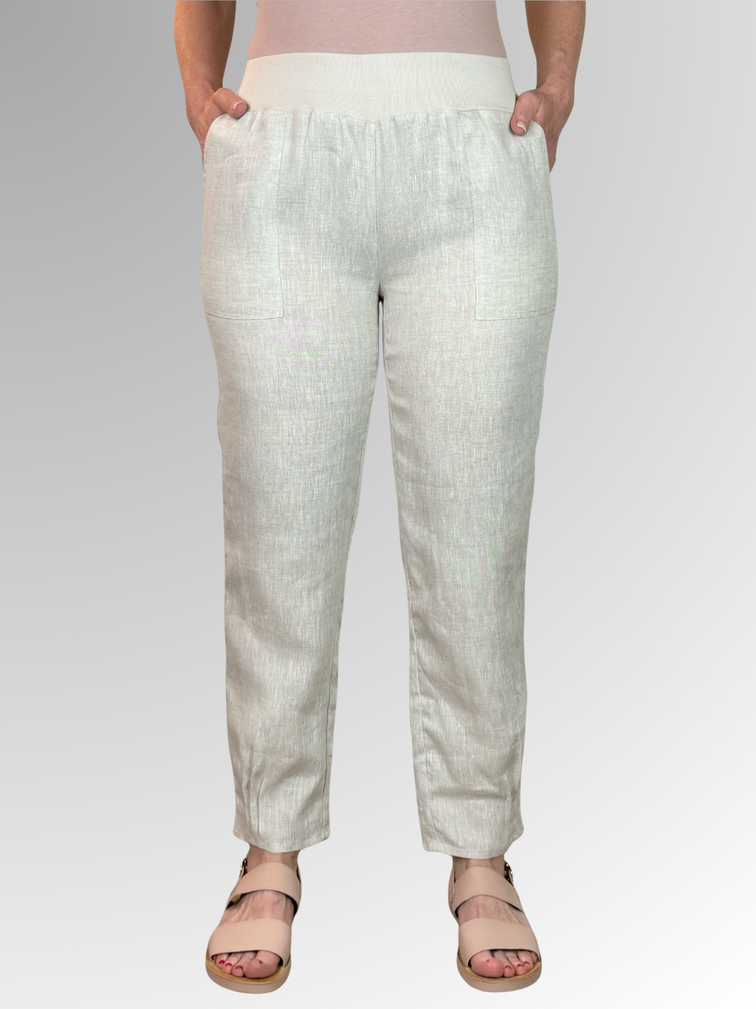 The Catalina Linen Pant by Maglia is the ultimate choice for summer style. With its cool and comfortable fit, ribbed elastic waistband, and tapered tuck detail at the ankle, these pants are both trendy and practical. Perfect for any summer outing, and with the added bonus of pockets, you can't go wrong with this relaxed fit pant.
