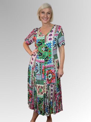 Introducing the Sao Bento Godet Dress by Orientique! Made from soft, sustainable rayon, this dress features a hand painted patchwork print in a gorgeous array of colours. The crinkle fabric is oh-so-comfy with no ironing required. Featuring short sleeves, a flattering V-neckline and godet panels through the skirt that create a beautiful drape and swing. Perfect for summer, this cool and flowy dress is a must-have addition to your wardrobe.