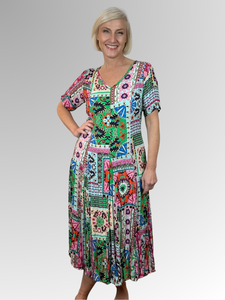 Introducing the Sao Bento Godet Dress by Orientique! Made from soft, sustainable rayon, this dress features a hand painted patchwork print in a gorgeous array of colours. The crinkle fabric is oh-so-comfy with no ironing required. Featuring short sleeves, a flattering V-neckline and godet panels through the skirt that create a beautiful drape and swing.&nbsp;Perfect for summer, this cool and flowy dress is a must-have addition to your wardrobe.