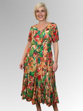 Introducing the Sao Paulo Godet Dress by Orientique! Made from soft, sustainable rayon, this dress features a hand painted leaf print in a gorgeous array of colours. The crinkle fabric is oh-so-comfy with no ironing required. Featuring short sleeves, a flattering V-neckline and godet panels through the skirt that create a beautiful drape and swing.&nbsp;Perfect for summer, this cool and flowy dress is a must-have addition to your wardrobe.
