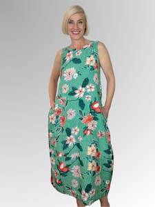 Stay cool and comfortable this summer in the Kaleici Sleeveless Bubble Dress by Orientique. Crafted from a blend of rayon, cotton, and linen, this dress is perfect for everyday wear. It features two pockets and a relaxed fit for ease of movement. Featuring a beautiful floral design for a feminine look, this is the perfect addition to your summer wardrobe.