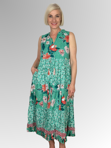 The Orientique Kaleici Sleeveless Tassel Dress is a stylish choice for the warmer weather. Crafted from 100% organic cotton, this dress is lightweight, breathable and comfortable. Featuring tasseled ties, pockets, fine gathering on each layer and a ruffled hemline for a feminine look. Enjoy the beautiful floral print for a look that stands out.