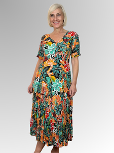 Introducing the Guaratiba Godet Dress by Orientique! Made from soft, sustainable rayon, this dress features a hand painted tropical print in orange, teals and black. The crinkle fabric is oh-so-comfy with no ironing required. Featuring short sleeves, a flattering V-neckline and godet panels through the skirt that create a beautiful drape and swing.&nbsp;Perfect for summer, this cool and flowy dress is a must-have addition to your wardrobe.