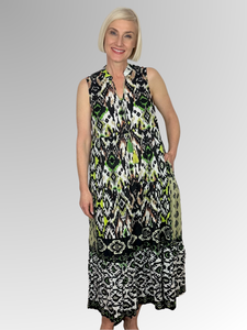 The Izmir Green Sleeveless Tassel Dress by Orientique is crafted from organic crinkle cotton for comfort and breathability. The dress features a striking tribal design, tasseled ties at the neckline, plus two side pockets for added convenience. Enjoy cool and comfortable days in style!