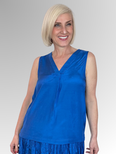Elevate your core wardrobe with the effortlessly chic Blue Lux Sleeveless Top by Escape. This sophisticated staple offers a beautifully polished look with its subtle satin-like sheen, making it easy to dress up or down. Crafted from premium, breathable rayon, it feels incredibly light and smooth against the skin, delivering a fluid drape that moves gracefully with you.