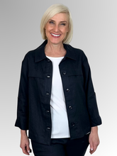 Meet the Button-Through Linen Resort Jacket in Navy, your new go-to layer for effortless, everyday style. Crafted from 100% pure linen, this lightweight jacket combines a relaxed, breezy silhouette with tailored details. It features a classic shirt collar and a full button-down front, making it easy to wear open over a tank or closed as a structured shirt. Designed for ultimate versatility, the sleeves come with built-in tab-and-button cuffs so you can easily roll them up on warmer days. 