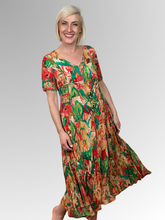 Introducing the Sao Paulo Godet Dress by Orientique! Made from soft, sustainable rayon, this dress features a hand painted leaf print in a gorgeous array of colours. The crinkle fabric is oh-so-comfy with no ironing required. Featuring short sleeves, a flattering V-neckline and godet panels through the skirt that create a beautiful drape and swing.&nbsp;Perfect for summer, this cool and flowy dress is a must-have addition to your wardrobe.