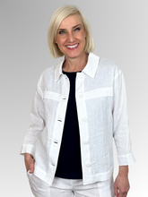 Meet the Button-Through Linen Resort Jacket in White, your new go-to layer for effortless, everyday style.&nbsp;Crafted from 100% pure linen, this lightweight jacket combines a relaxed, breezy silhouette with tailored details. It features a classic shirt collar and a full button-down front, making it easy to wear open over a tank or closed as a structured shirt. Designed for ultimate versatility, the sleeves come with built-in tab-and-button cuffs so you can easily roll them up on warmer days.