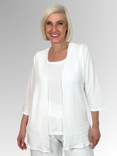 Effortless style meets everyday comfort with our White Two Piece Textured Set. Designed to take the guesswork out of styling, this chic coordinates package features a classic inner camisole paired with a perfectly matched, relaxed edge-to-edge jacket. Crafted from a premium polyester elastane blend, the fabric offers a lightweight feel with just the right amount of comfortable stretch.
