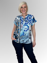The Nimes Popover Top by Orientique brings a refined, artisan-inspired charm to your warm-weather wardrobe. Crafted from certified organic cotton, this lightweight top offers ultimate breathability and exceptional softness for comfortable all-day wear.