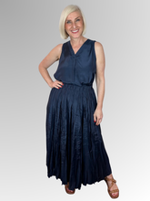 Elevate your core wardrobe with the effortlessly chic Navy Lux Sleeveless Top by Escape. This sophisticated staple offers a beautifully polished look with its subtle satin-like sheen, making it easy to dress up or down. Crafted from premium, breathable rayon, it feels incredibly light and smooth against the skin, delivering a fluid drape that moves gracefully with you.