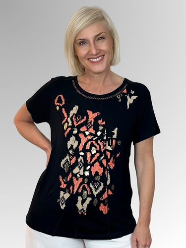 The Christina Top by Bagoraz is a playful blend of comfort and style. Made in Portugal from soft viscose elastane, it features a dark navy base with an eye-catching abstract foil print down the front. Unique criss cross contrast stitching accents the neckline, while stitch detail panels add a fashionable twist. This top brings a fresh, stylish flair to your wardrobe with its standout details and comfy fit.