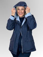Get two looks in one with our Courtney Reversible Jacket. Flip between navy and rich blue, with contrasting cuffs that beautifully highlight the colour change. A detachable hood, practical pockets and zip-and-stud front closure give you complete control over the elements, while an adjustable drawstring waist delivers a custom fit. Made from durable polyester, this versatile jacket handles unpredictable weather with ease making it ideal for travellers and anyone who loves flexible wardrobe options.