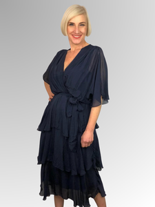 Made in Italy, this stunning silk and viscose dress features a flattering V-Neck, cape like sleeves for coverage and soft layering making it the ideal piece for any special occasion. Lined with a lightweight soft jersey for comfort, this is a dress that's sure to impress.