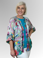 The Lesante 3/4 Sleeve Overshirt by Lula Soul offers a pretty and feminine style with its flouncy silhouette and delicate floral print featuring birds. Crafted from silky viscose, it feels smooth against the skin and is perfect worn open over a coordinating camisole for a playful, breezy look.