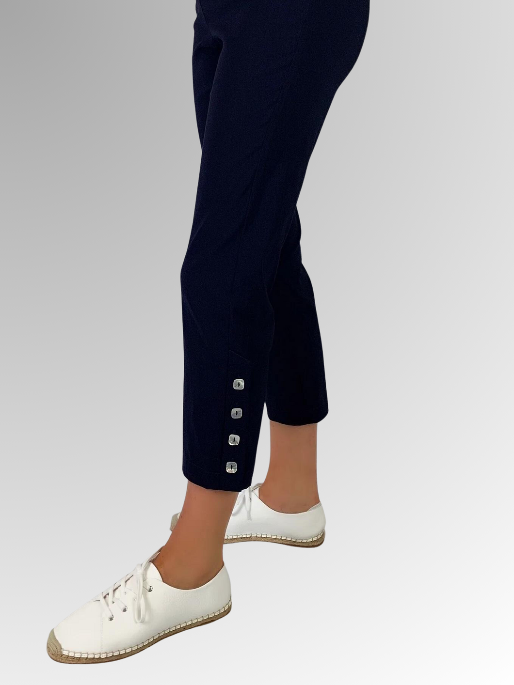 The Corsican Navy Marina Pant is an essential summer style. Made from a combination of Rayon, Nylon, and Spandex, it features a 7/8 length tapered leg and four mother-of-pearl buttons on the side. The stretch fabric and elastic waist provide both comfort and mobility, making it a stylish choice. Choose from four classic colours, all proudly made in Australia and machine-washable.