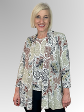The Corsican Outback 3/4 Sleeve Edge to Edge Jacket features a stylish floral design in earthy tones with highlights of puff paint. Its versatility makes it suitable for a variety of occasions; moreover, it can be matched with a complementing cami to further accentuate the print, alternatively it does have a coordinating top. This polyester/spandex jacket is made in Australia and requires minimal maintenance, making it ideal for travelling. 