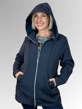 The Apex Jacket in navy is your go-to layer for unpredictable weather. Crafted from durable polyester, it features a detachable hood for flexible coverage, a zip front for easy on-and-off, and practical pockets to keep essentials close. Lined with soft fleece for added warmth, it's designed to keep you warm and dry. An adjustable drawstring band cinches at the waist for a custom fit. Whether you're running errands or heading out for the day, this everyday jacket delivers reliable protection and style.