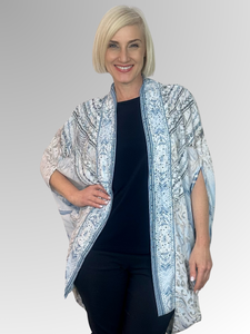 Sparkle and shine in our Selena Wrap Jacket! This kaftan style jacket features dazzling diamante trim, adding a touch of bling to your look. The relaxed and flowing design makes it perfect for any occasion. Made with easy-care polyester, it's the perfect piece to dress up and party in style!