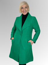Wrap yourself in luxury with our Boiled Wool Emerald Pea Coat. Certified with the prestigious Woolmark label, this modern, soft boiled wool coat is both warm and stylish. Featuring a contemporary take on the classic coat, it's the perfect statement piece for any fashion-forward wardrobe. Upgrade your look and embrace true quality.
