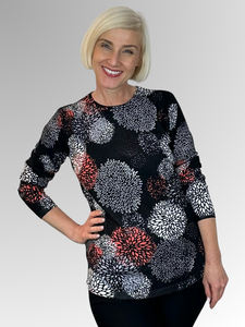 Elevate your wardrobe with our Black/Paprika Fireworks Pullover. This vibrant statement piece is both soft and lightweight, keeping you warm from day to night. Crafted from a luxurious blend of viscose and nylon, it's perfect for any occasion.