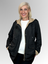 Get two looks in one with our Courtney Reversible Jacket. Flip between black and rich camel, with contrasting cuffs that beautifully highlight the colour change. A detachable hood, practical pockets and zip-and-stud front closure give you complete control over the elements, while an adjustable drawstring waist delivers a custom fit. Made from durable polyester, this versatile jacket handles unpredictable weather with ease making it ideal for travellers and anyone who loves flexible wardrobe options.