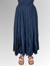Embrace effortless elegance with the Navy Lux Crinkle Skirt by Escape. Perfectly complementing your warm-weather wardrobe, this maxi-length skirt is crafted from premium, breathable rayon that offers a beautiful, fluid drape and a subtle satin-like luster. It features a signature crinkle texture that provides a naturally low-maintenance finish; perfect for travel and busy days since it requires absolutely no ironing.