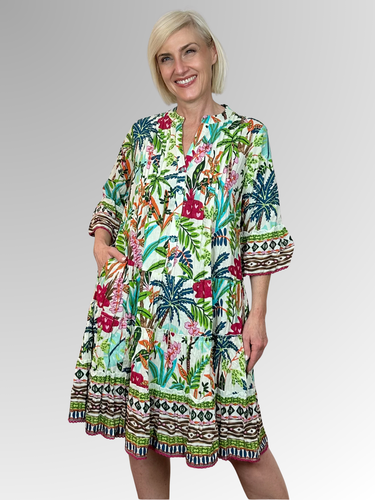 Discover effortless summer style with the Ovahe 3/4 Sleeve Frill Dress by Orientique. This delightful design features an A-line silhouette, charming ruffled tiers and relaxed 3/4 length frill sleeves for that perfect carefree vibe. The mandarin collar brings a touch of flair, while the comfortable fit keeps you feeling fabulous all day long. Made from 100% organic cotton, it's soft, breathable and perfect for lazy afternoons or casual outings.