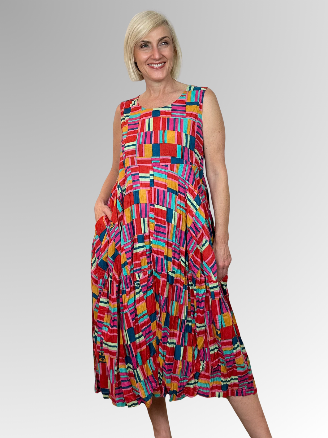 The Peru Sleeveless Bubble Dress captures everything Orientique is known for; bold artistry, vibrant colour and genuine comfort. Made from 100% organic crinkled cotton, it features a relaxed shape and a softly gathered bubble hem keeping you cool and comfortable all day long. It's the dress you'll reach for again and again when you want to feel effortlessly stylish without any fuss.