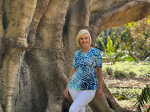 The Shades of Blue Pleated Top by Renoma brings a stylish and fun edge with its distinctive crinkle pleats. Crafted from easy-care polyester, this top requires no ironing, making it effortless to maintain. Perfect for dressing up any outfit, it’s also ideal for travelling, offering a chic and wrinkle-free look wherever your journey takes you.