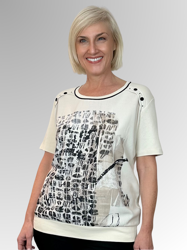 Made in Portugal, the Helena Top by Bagoraz combines playful style with comfort. Crafted from a blend of cotton and polyester, it features a contrast trim neckline and charming button and stud details on the shoulders. The front made from polyester showcases an abstract design, while the back is soft, plain cotton. Finished with a waistband and a generous relaxed fit, this top brings a fun, breezy vibe to your day.