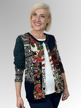 The Zapotec Cardi Top by Orientique is a fun and modern addition to any wardrobe. Its spliced design offers versatility, allowing you to wear it open with a plain top underneath or buttoned up for a more polished look. Made with a navy base colour and crafted from rayon and spandex, this top is both comfortable and stylish. A must-have for any fashion-forward individual!