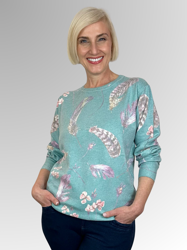 Embrace luxury and fun with our Mint Feathers Pullover. Made from a soft cotton, rayon, and cashmere blend, this pullover features fine stud trim highlights for a touch of glamour. Dress it up or wear it casually for a versatile and playful addition to your wardrobe.