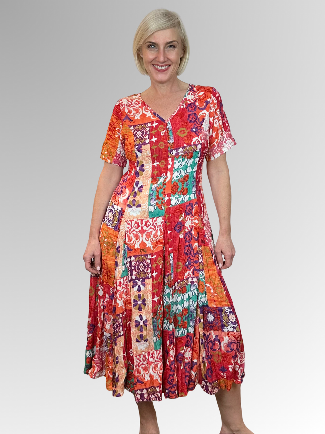 Introducing the Araya Godet Dress by Orientique! Made from soft, sustainable rayon, this dress features hand painted Persian and Oriental motifs in a gorgeous mix of jade, watermelon and peach tones. The crinkle fabric is oh-so-comfy with no ironing required. Featuring short sleeves, a flattering V-neckline and godet panels through the skirt that create a beautiful drape and swing. Perfect for summer, this cool and flowy dress is a must-have addition to your wardrobe.