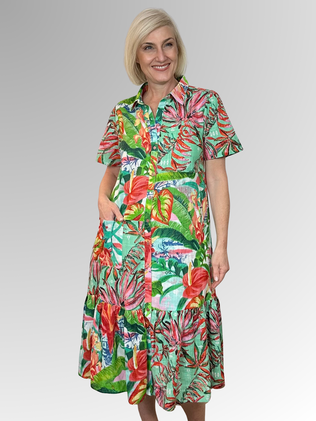 Experience comfort and breathability with the Equador Collared Patch Dress by Orientique. Crafted from organic cotton, its bold and summery design adds a stylish and versatile touch to your wardrobe. Featuring a button-through front, patch pocket, and flattering ruched hemline, this must-have dress will brighten up your day!