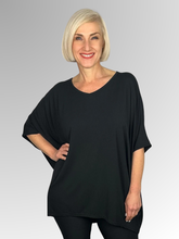 Our Bamboo Easy Top is made from 95% Bamboo and 5% Elastane making it super light and silky soft. Being a breathable fabric, it draws moisture away from your body keeping you cool and fresh. Generously shaped and great for covering those curves, it's the ideal go to for any time of day. Available in a range of beautiful colours, team it with some great accessories to make it pop!