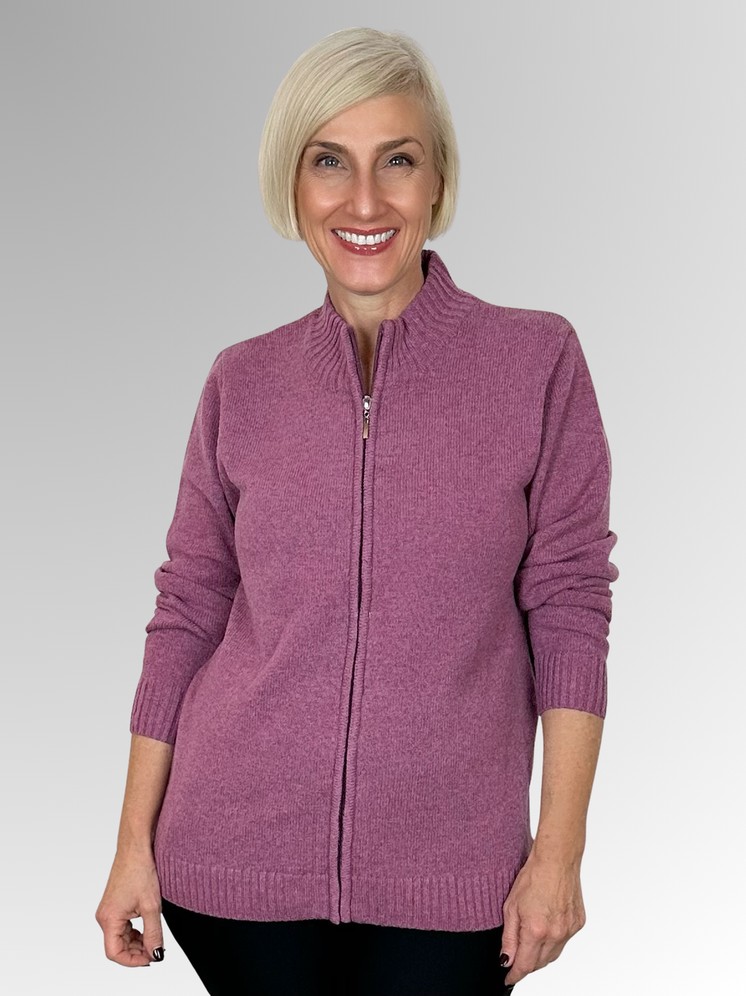Introducing the Lambswool Folly Zip Cardigan by Bromley, the perfect addition to any winter wardrobe. Made from 100% lambswool, this versatile piece offers both warmth and style with its stand-up neckline. Wear it zipped up as a top or open with a layer underneath for a comfortable and fashionable look. Trust in the quality of Bromley to keep you cosy all season long.