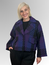 The Elena Wang Crosshatch Purple Jacket combines effortless style with thoughtful design. Crafted from a luxurious polyester and wool blend, this piece features a relaxed cropped boxy silhouette that flatters every frame. Flared sleeves add a contemporary edge, while full lining delivers a polished, refined finish. Perfect for elevating casual and dressed-up looks alike, this fashionable jacket is a versatile wardrobe essential that works with everything.