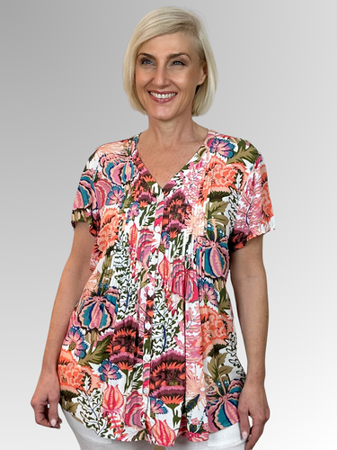 Embrace sunny days in the Chloe Pintuck Shirt by Callan, crafted from soft, lightweight rayon for a cool, floaty feel. Its playful V-neck and pintuck details down the front and back add charming style, while the relaxed, A-line fit moves with you effortlessly. Bursting with colourful floral patterns, this summery top is perfect for brightening any casual outing.