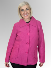 Indulge in sophistication with our Boiled Wool Pink Squiggle Jacket, featuring the Woolmark emblem as a mark of excellence for Pure New Wool. This luxurious, plush design will add a touch of style to your winter wardrobe. Practical pockets keep your essentials close, while the button to the neck design allows for extra warmth. The stylish collar frames your face, and distinctive raw edge squiggle detailing adds an artistic, contemporary touch that sets this jacket apart from the ordinary.