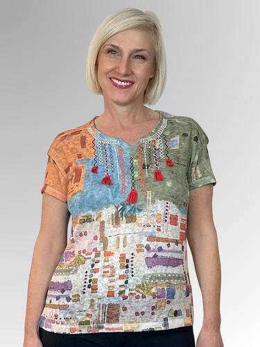 Refresh your wardrobe with the Kalisson Liliana Top! Expertly made in Portugal, this stylish piece is perfect for women who love colour, sumptuous textures, and unbeatable comfort. Crafted from a premium polyester knit, it features detailed embroidery and fun tassels around the neckline for an extra playful vibe. Let Kalisson add a lively twist to your look!