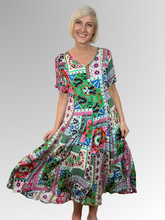 Introducing the Sao Bento Godet Dress by Orientique! Made from soft, sustainable rayon, this dress features a hand painted patchwork print in a gorgeous array of colours. The crinkle fabric is oh-so-comfy with no ironing required. Featuring short sleeves, a flattering V-neckline and godet panels through the skirt that create a beautiful drape and swing. Perfect for summer, this cool and flowy dress is a must-have addition to your wardrobe.
