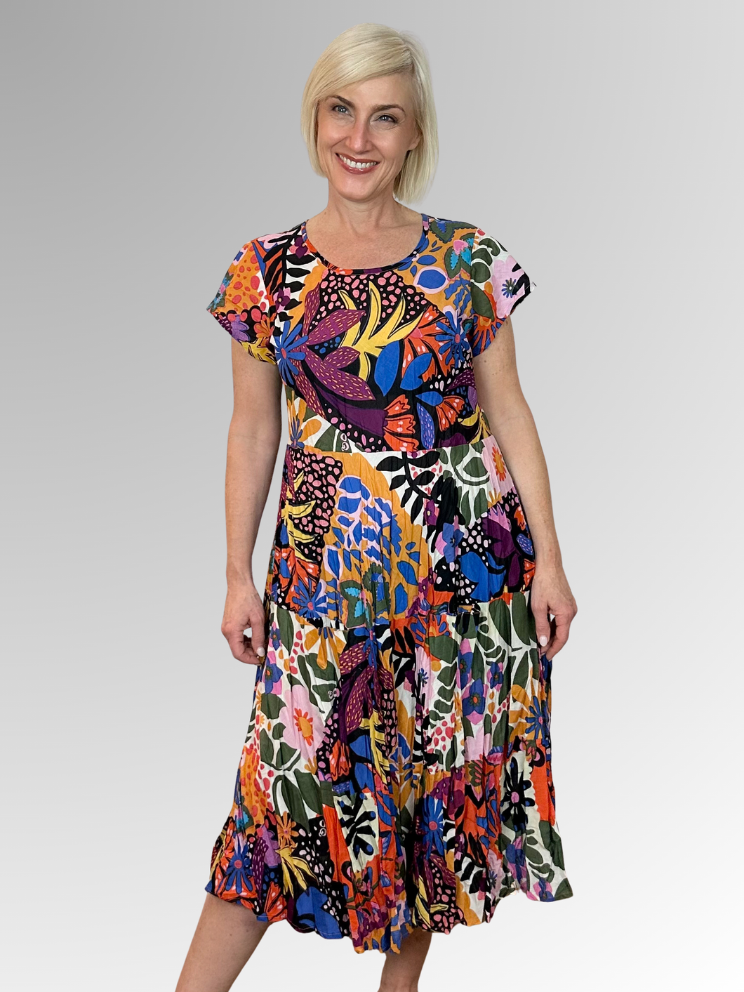 Escape the heat in style with the Salvador Crinkle Layered Pocket Dress by Orientique. This breezy number features a round neckline, short sleeves, and practical pockets to keep your essentials close. The eye-catching multi-coloured print brings instant personality to any warm-weather occasion, while the lightweight crinkle fabric keeps you cool and comfortable. Whether you're exploring a new destination or simply enjoying a leisurely afternoon, this dress delivers effortless charm. Crafted from 100% organi